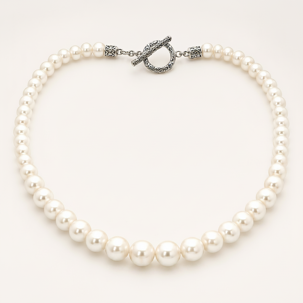 Collana Mutiara perle d'acqua dolce scalare Balinesia, vista dall'alto con chiusura toggle in argento 925 filigrana balinese