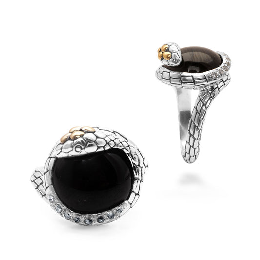 Anello Cobra Onyx Collezione Black Mamba Balinesia, doppia vista su sfondo bianco — frontale con onice e white topaz e profilo laterale — argento 925 ossidato con occhio in oro