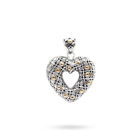 Ciondolo Hati Celuk Balinesia su sfondo bianco, vista frontale, ciondolo a cuore aperto in argento 925 ossidato con sfere in oro 18K e texture a cerchi concentrici, bail decorato a diamante, Collezione Viaggio a Celuk